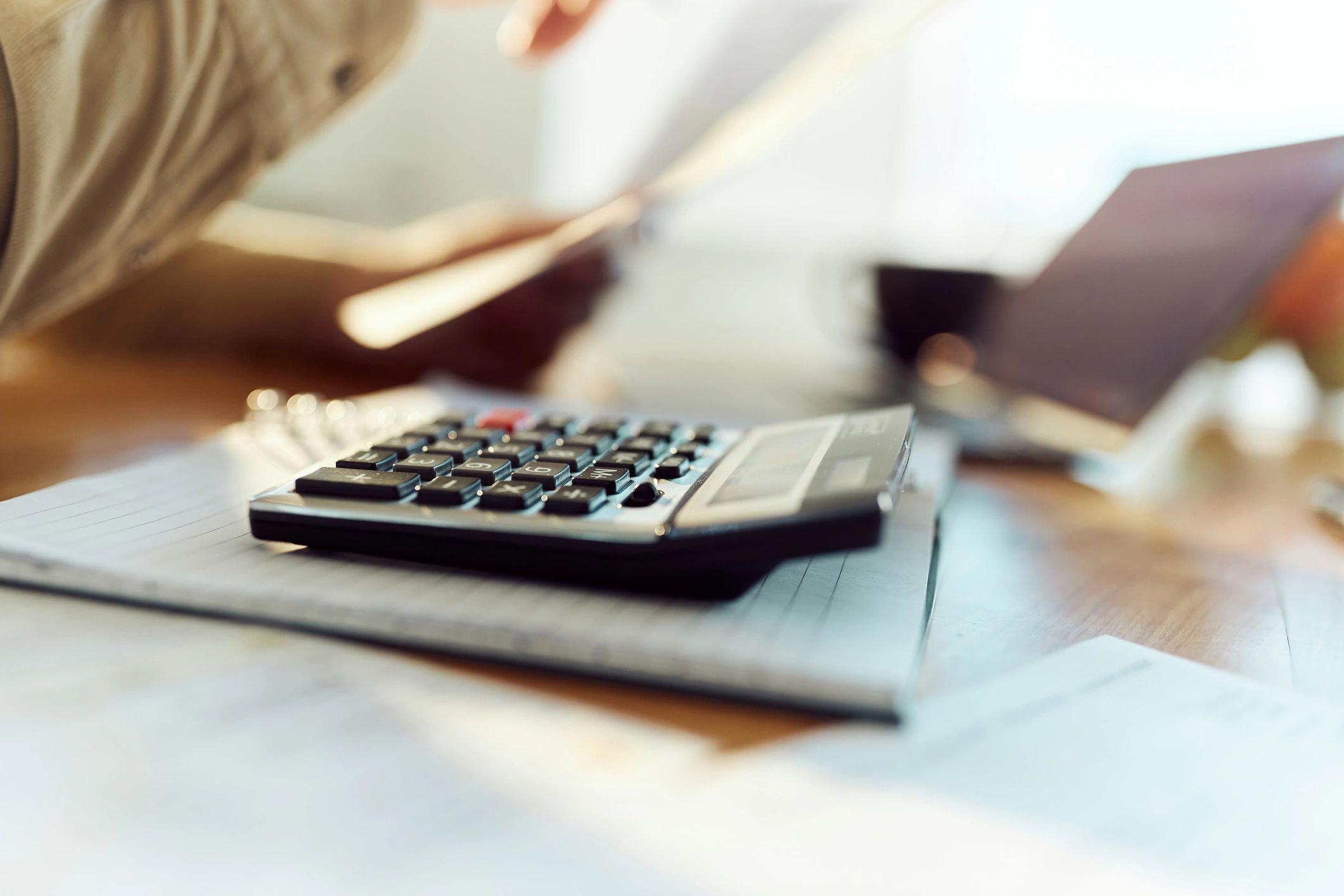 Calculator on a notepad for budgeting