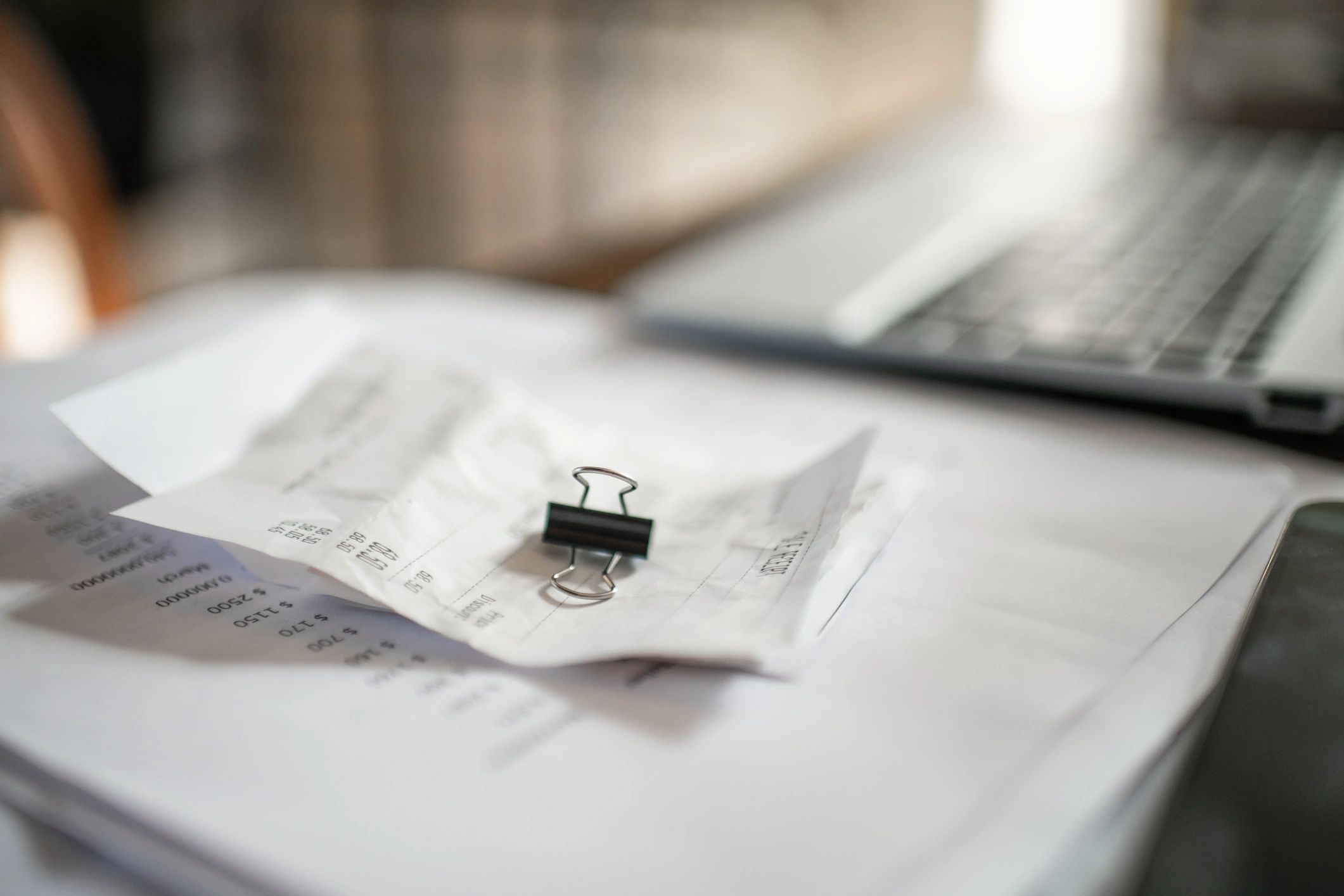 Laptop and documents on a table