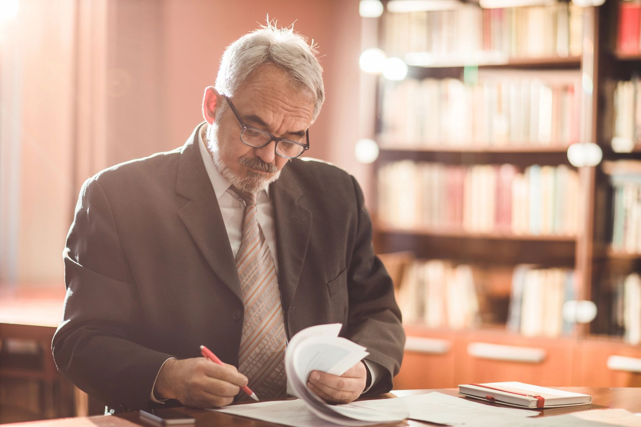Businessperson signing documents